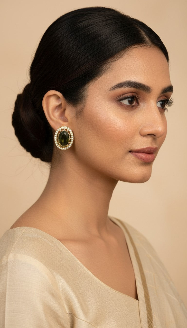 SHE BEAUTY AD antique tops featuring an oval green stone surrounded by small white crystals on a model