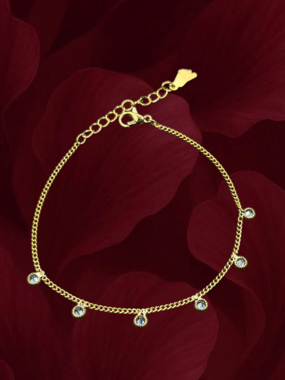SHE BEAUTY gold-toned anti-tarnish kids anklet featuring delicate chain links and sparkling round crystal charms.