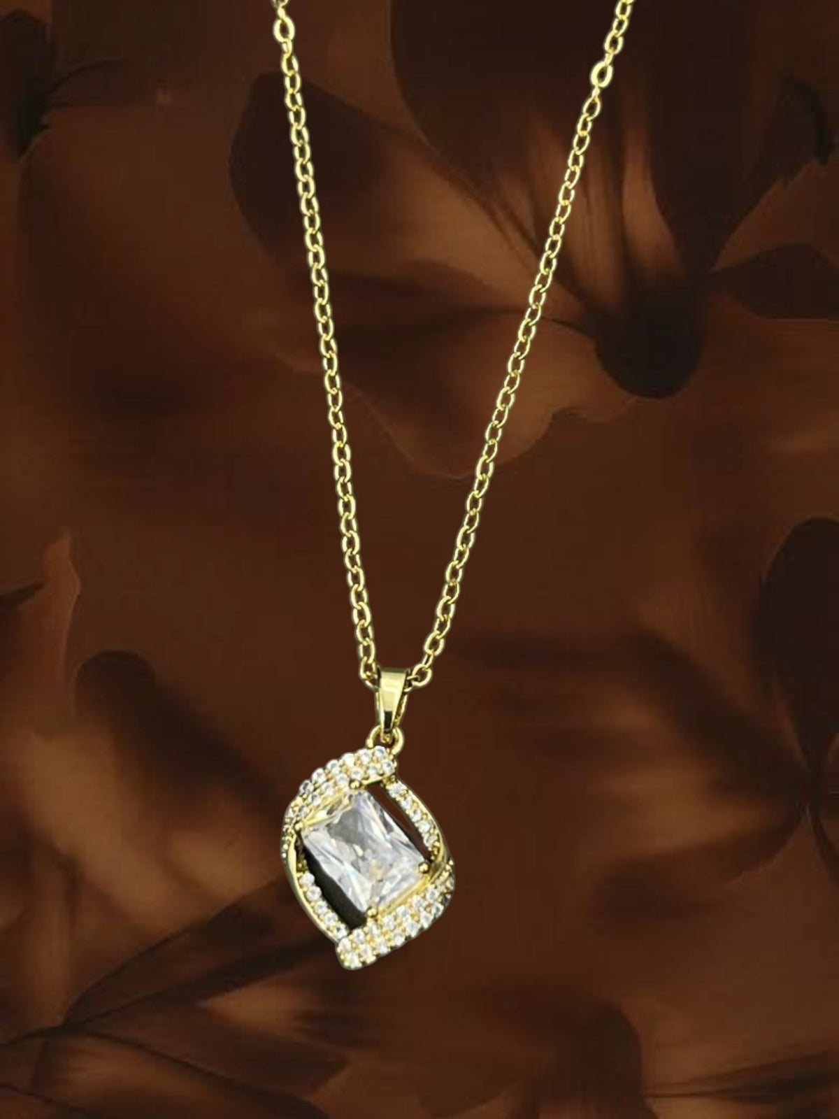 SHE BEAUTY Korean wave pendant necklace featuring a rectangular crystal stone in a gold-tone setting with pavé accents