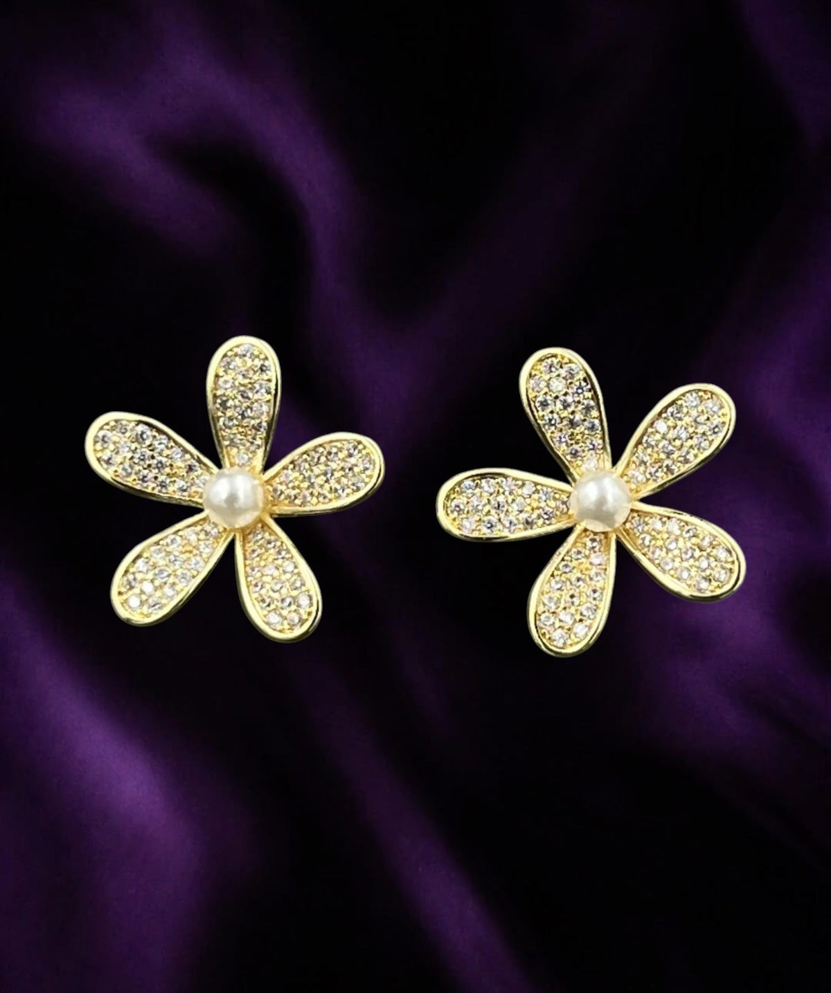 SHE BEAUTY 925 Flora post earrings featuring gold-tone flower petals with sparkling crystals and a central pearl