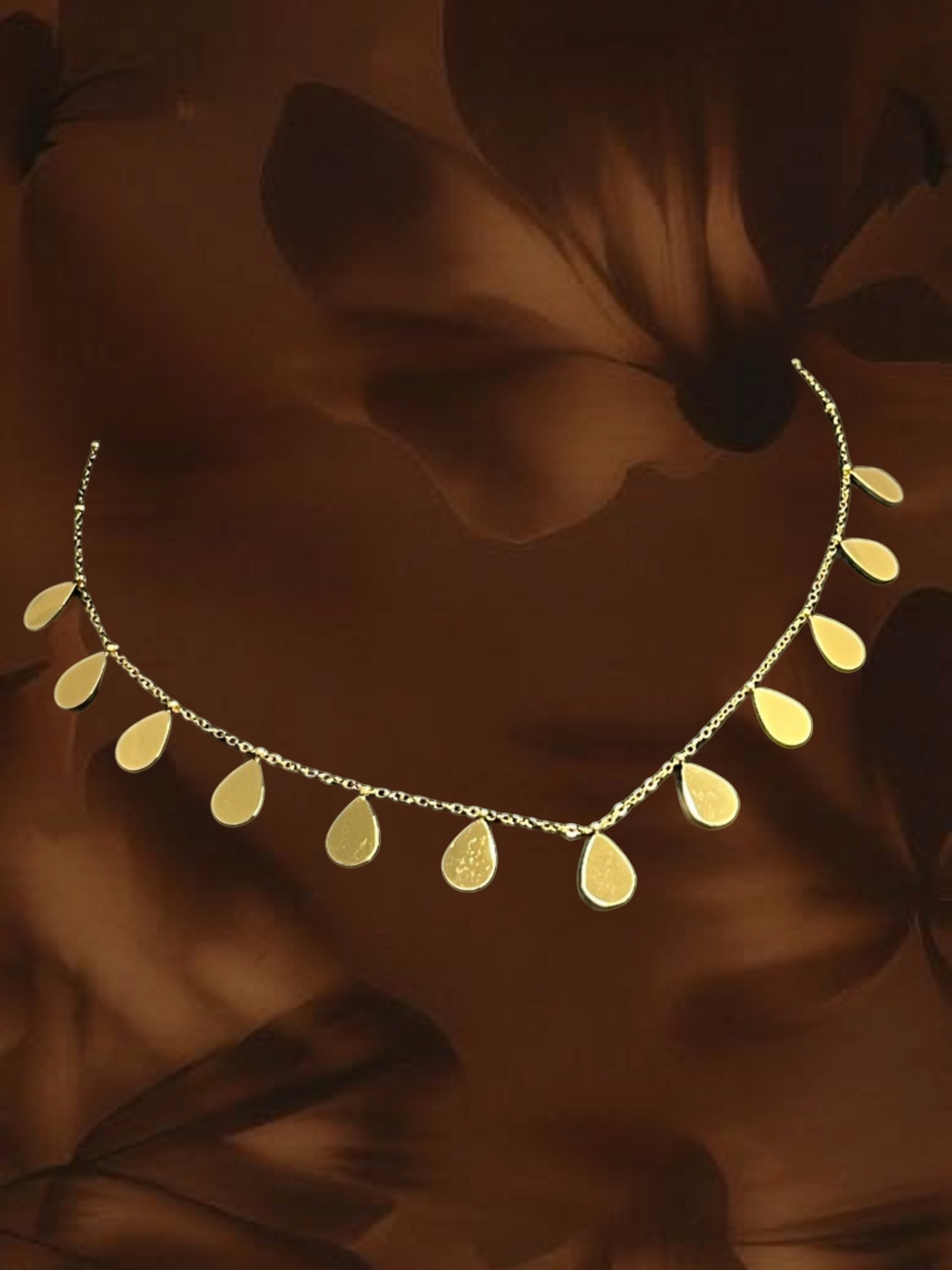 SHE BEAUTY gold-toned raindrop chain necklace with delicate teardrop charms for festive and everyday wear