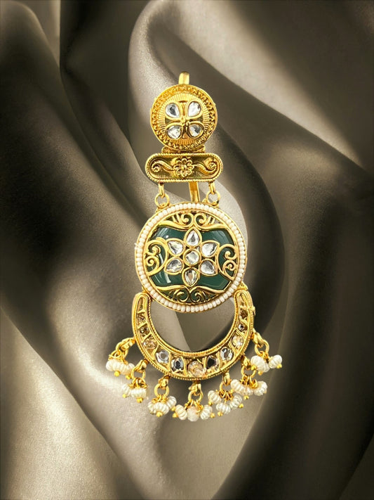 SHE BEAUTY Jaipuri floral hair brooch in gold with green enamel, kundan stones, and dangling pearl beads.