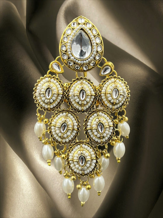 SHE BEAUTY Kundan Polki pearl juda hair brooch with intricate gold-toned metalwork and white stone accents.