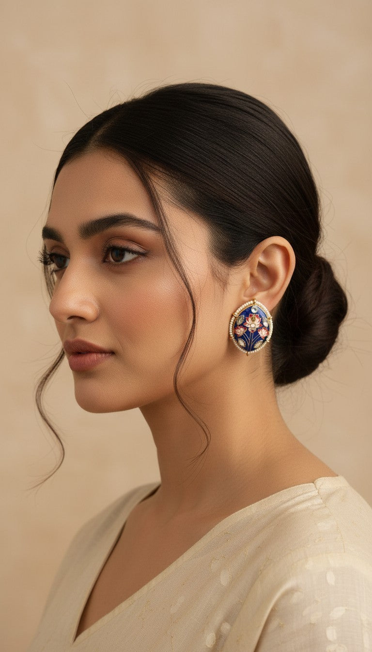 SHE BEAUTY Meenakari tops featuring blue enamel floral patterns with pearl accents worn by a woman in a side profile