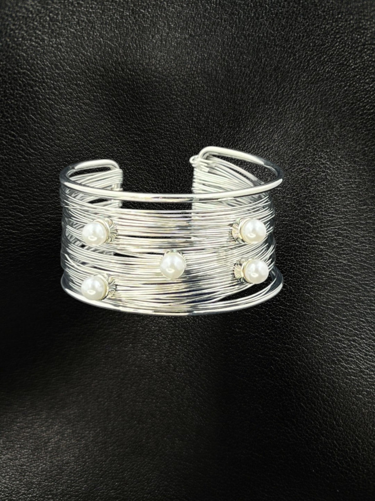 SHE BEAUTY silver multilayer cuff bracelet featuring five white pearls on a textured wire band for elegant style.