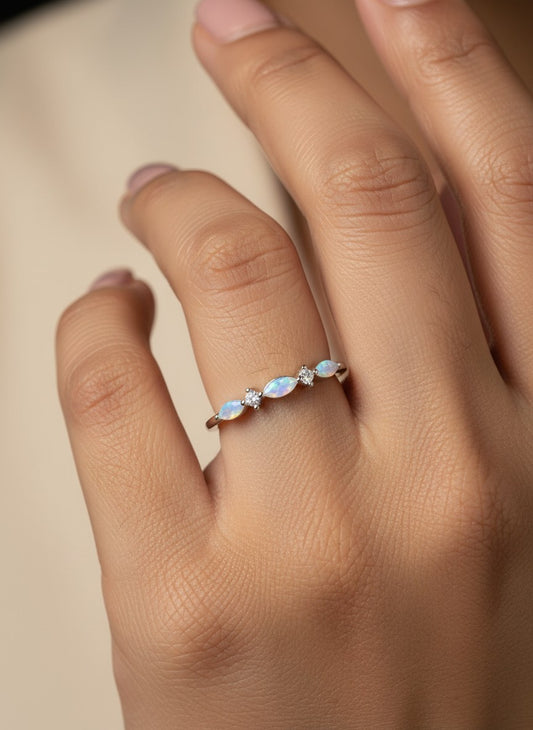 SHE BEAUTY sterling silver ring featuring marquise-cut opals and small round crystals on a delicate band