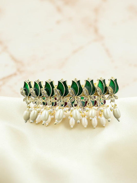 SHE BEAUTY AD tulip meenakari barrette featuring green enamel petals, sparkling stones, and dangling white pearls.