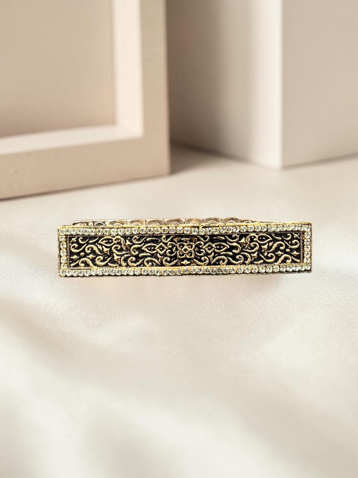 SHE BEAUTY vintage metallic barrette with intricate black lace-style filigree and sparkling crystal border