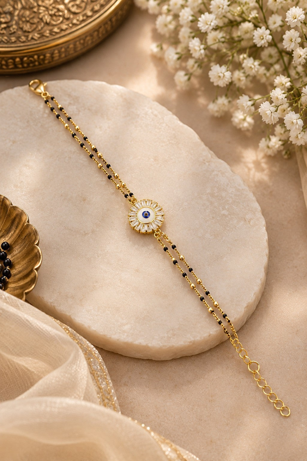 SHE BEAUTY anti-tarnish AD mangalsutra bracelet featuring a central evil eye charm with white stones and black beads.