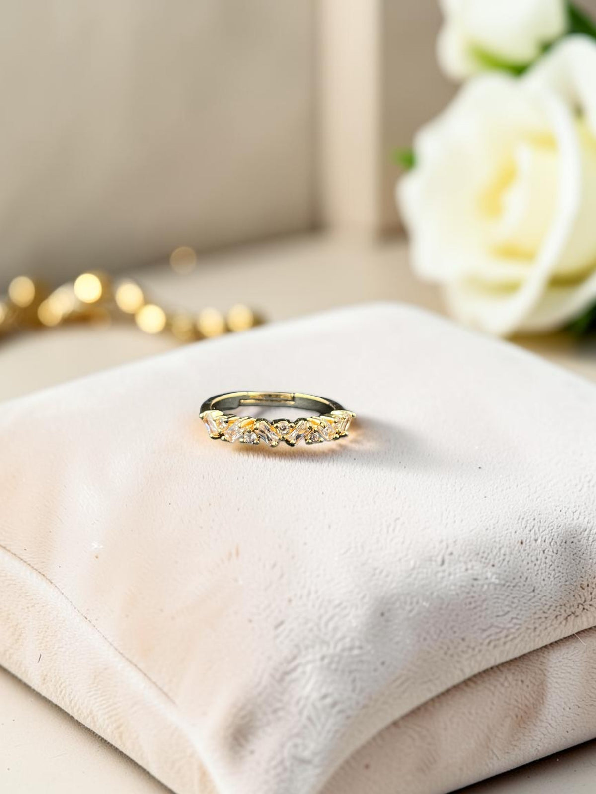 SHE BEAUTY anti-tarnish ring featuring sparkling marquise-cut stones in a gold-tone band on a velvet cushion.
