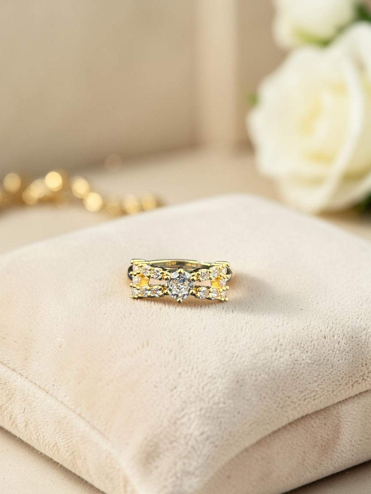 SHE BEAUTY anti-tarnish ring featuring a central cubic zirconia stone and delicate gold-tone band for festive wear