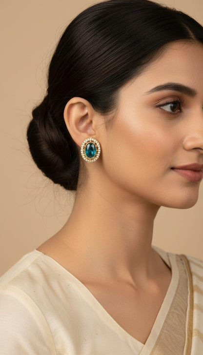 SHE BEAUTY AD antique tops featuring a central oval blue stone surrounded by small white pearls in a gold setting