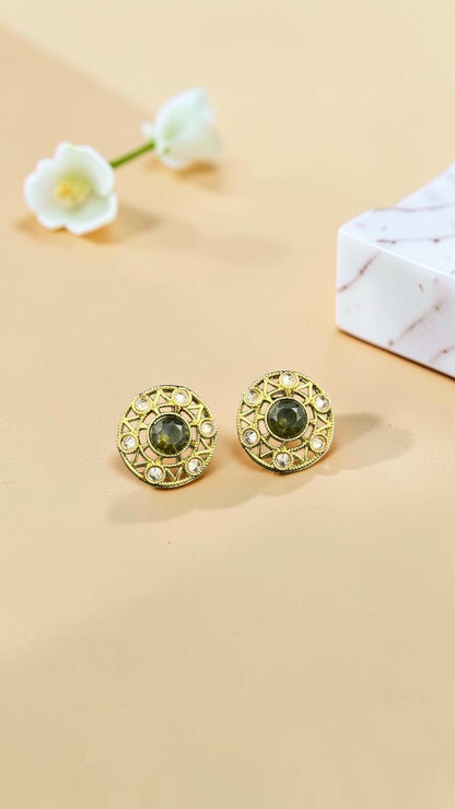 SHE BEAUTY antique gold-toned stud earrings with a central dark green stone and intricate filigree detailing.