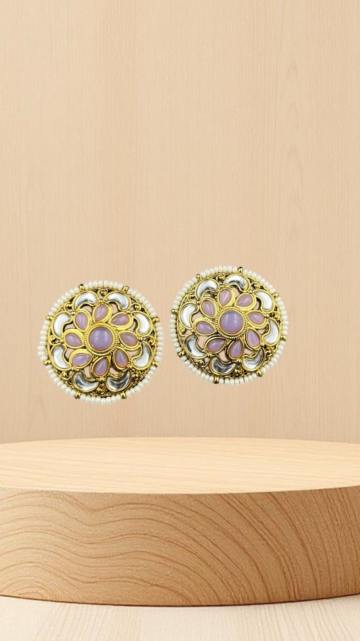 SHE BEAUTY antique kundan tops with pink stones, white accents, and pearl border on a wooden display stand.