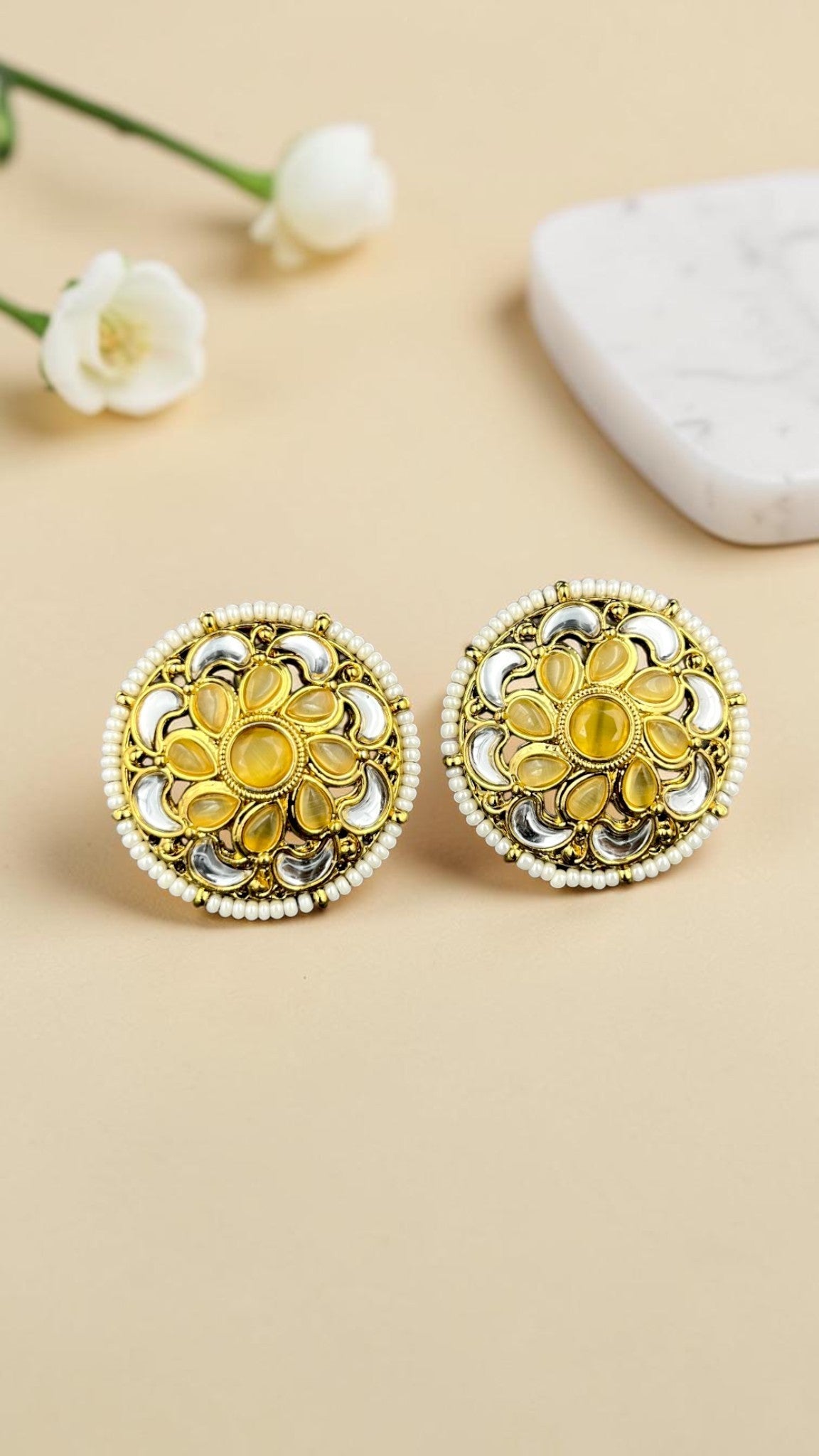 SHE BEAUTY antique kundan tops with yellow stones, white beads, and gold-toned metal in a circular floral design.
