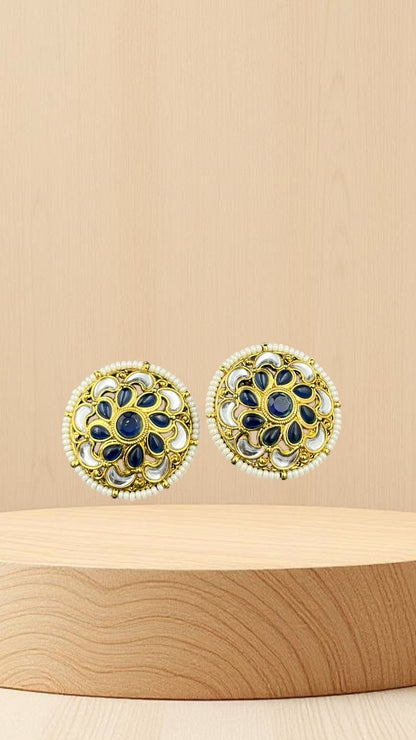 SHE BEAUTY antique kundan tops featuring blue stones, white accents, and pearl detailing in a round gold setting.
