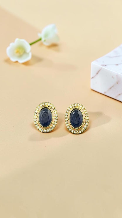 SHE BEAUTY AD antique tops featuring oval blue stones surrounded by a halo of sparkling crystals in a gold-tone setting