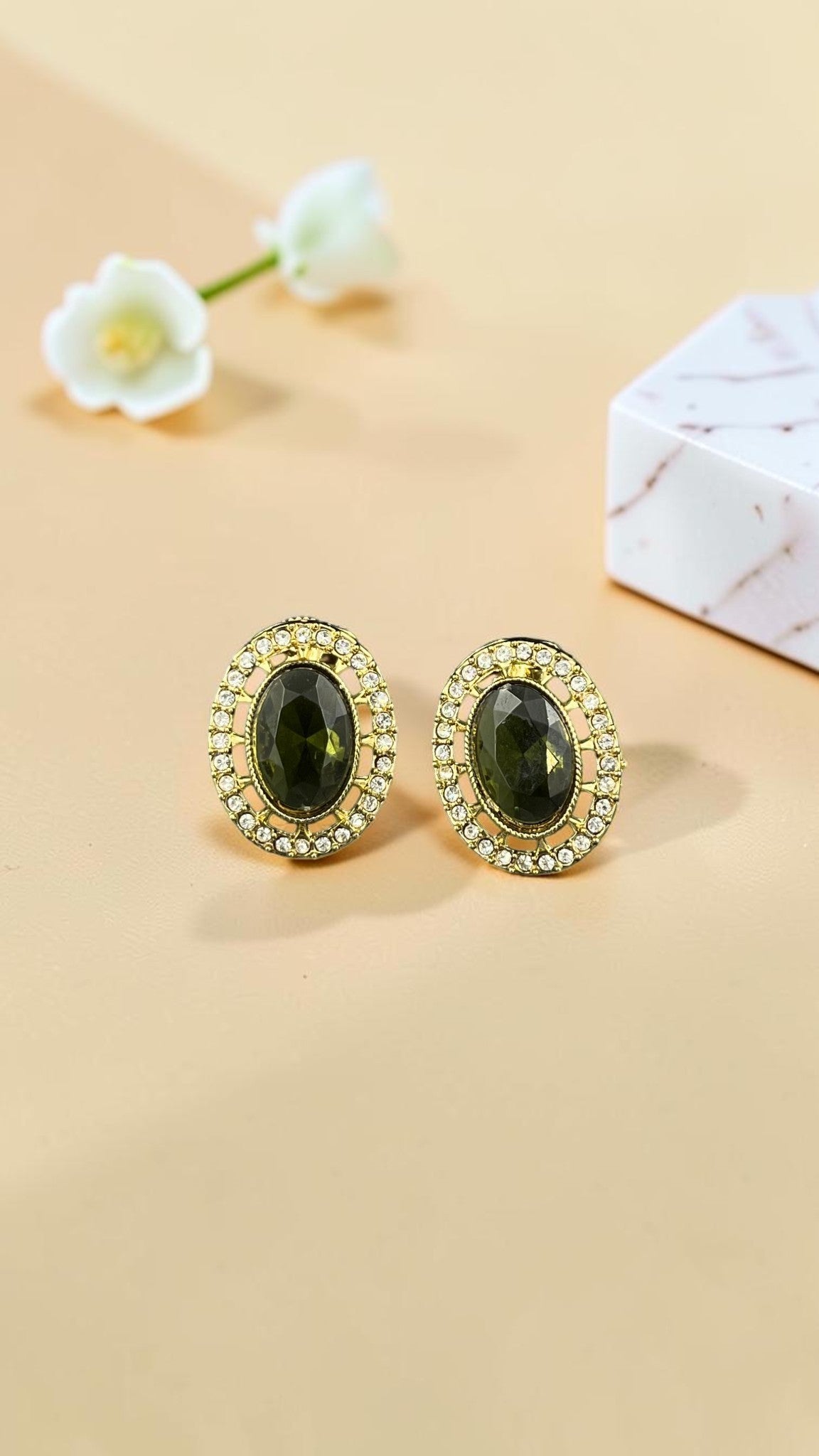 SHE BEAUTY AD antique oval stud earrings featuring a dark green central stone surrounded by sparkling white crystals
