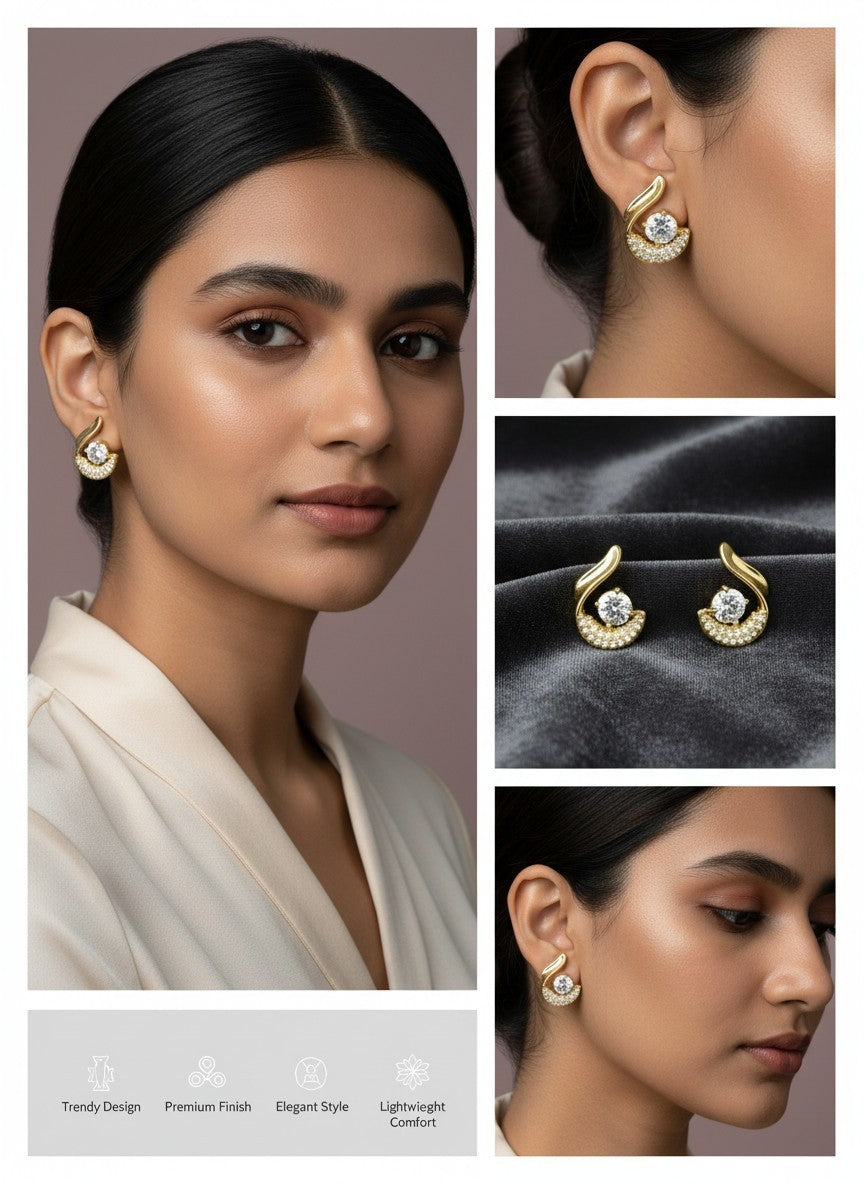 SHE BEAUTY AURA STUDS featuring gold-tone curved metal with a central crystal and pavé accents worn by a model.