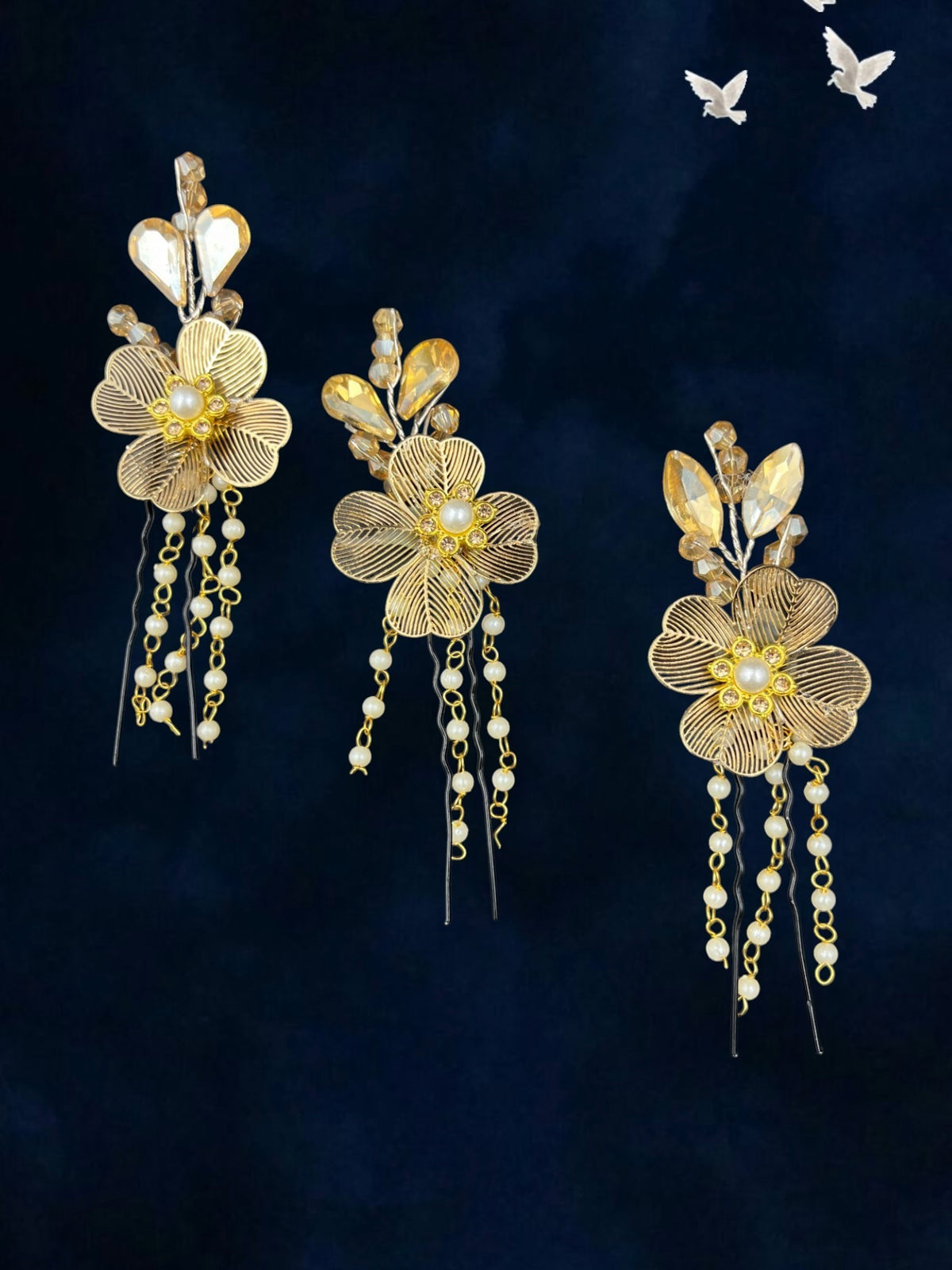 SHE BEAUTY blossom crystal and pearl bun hair pins featuring gold floral filigree designs with dangling bead chains.