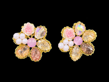 SHE BEAUTY BLUSH GARDEN floral stud earrings featuring pink rose accents, faceted crystals, and gold-tone settings.