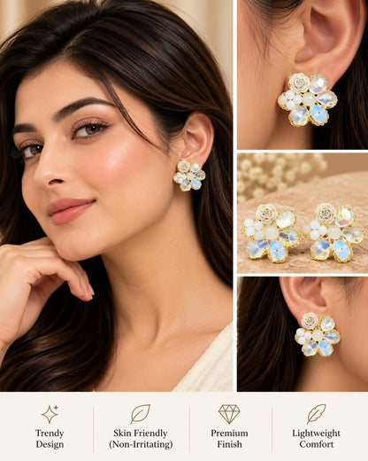 SHE BEAUTY BLUSH GARDEN floral stud earrings with iridescent crystals and white rose accents on a model