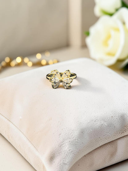 SHE BEAUTY anti-tarnish gold-tone ring featuring a delicate butterfly design with sparkling AD stones on a cushion.