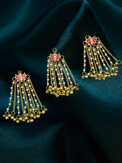 SHE BEAUTY butterfly Kundan Meenakari hair accessories with pearl chains and gold ghungroo bells on dark green fabric