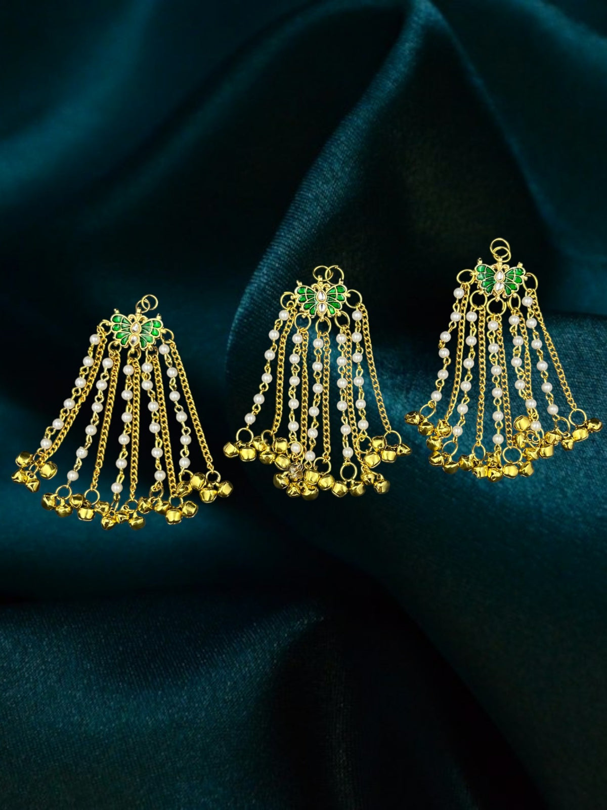 SHE BEAUTY 3-piece butterfly hair accessories with green meenakari, kundan, pearl beads, and gold ghungroo charms.