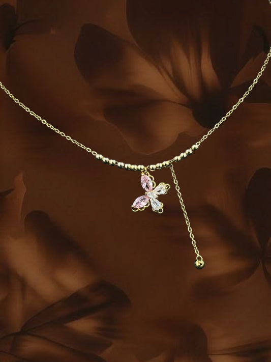 SHE BEAUTY gold-toned lariat necklace featuring a delicate butterfly pendant with pink and white crystal accents