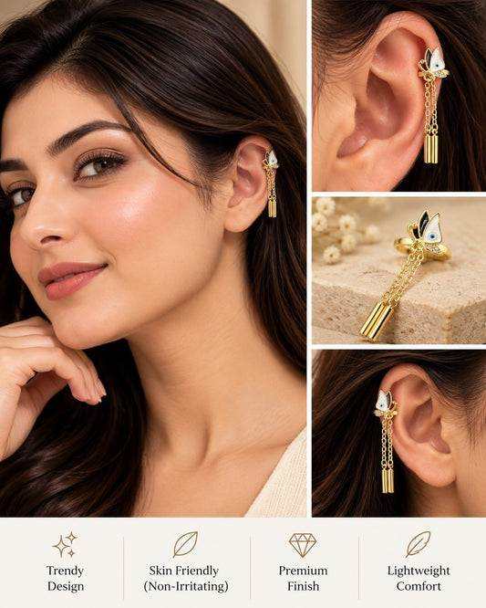 SHE BEAUTY BUTTERTRAILS CUFFS gold-tone ear cuff featuring a butterfly charm with dangling chain accents on a model.