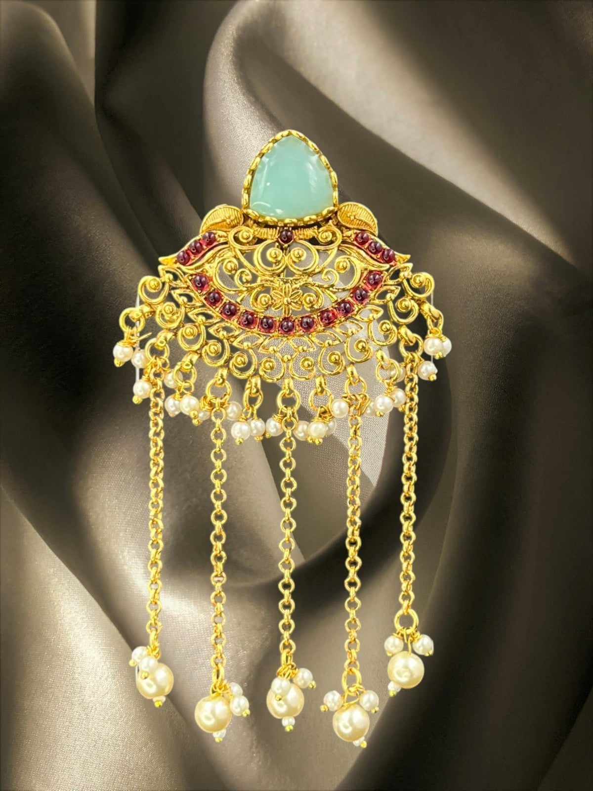 SHE BEAUTY gold-toned Chandbali Juda hair brooch with mint green stone, red accents, and dangling pearl chains.