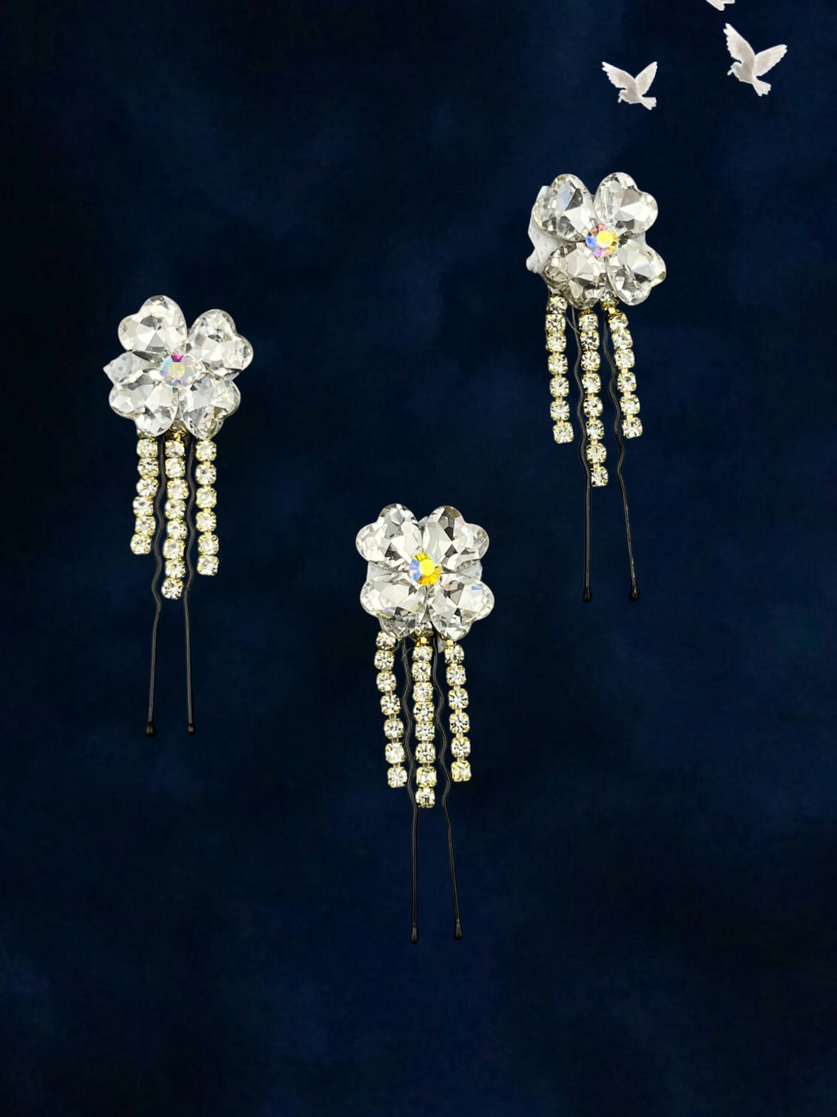 SHE BEAUTY clover crystal bun hair pins with dangling rhinestone chains on a dark blue background