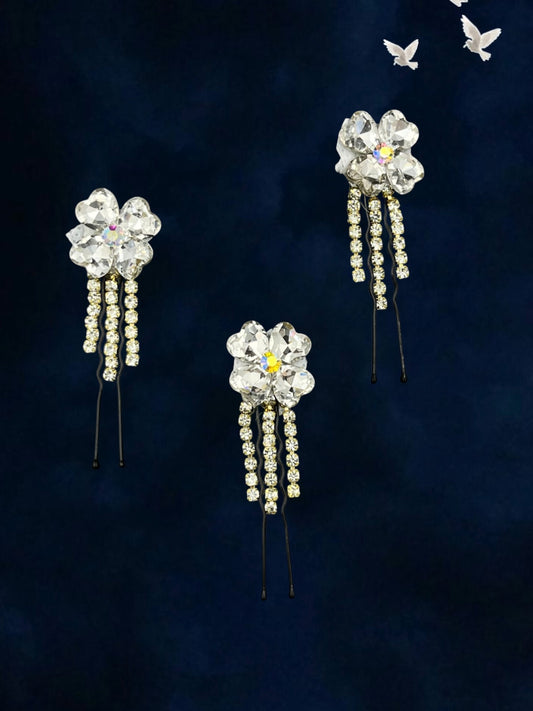 SHE BEAUTY clover crystal bun hair pins with dangling rhinestone chains on a dark blue background