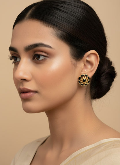 SHE BEAUTY COLOUR STUDS featuring black stones set in a gold-toned floral frame worn by a woman