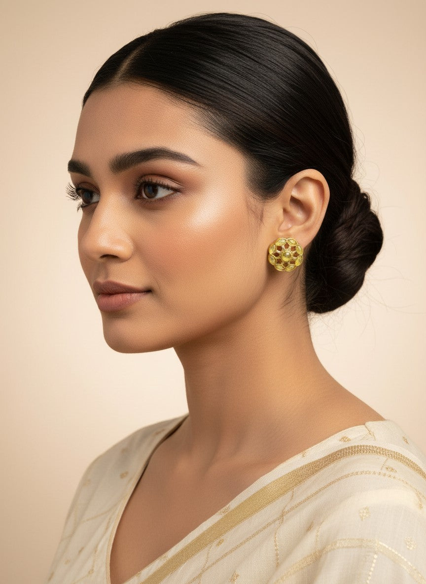SHE BEAUTY COLOUR STUDS featuring a round floral design with yellow stones worn by a woman in a cream ethnic outfit.