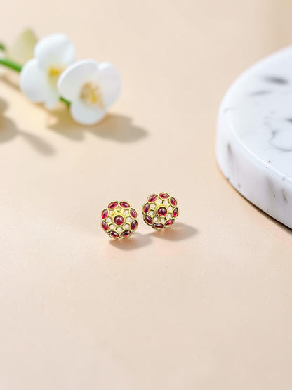 SHE BEAUTY COLOUR STUDS featuring gold-toned floral filigree design with deep red stone accents for ethnic wear