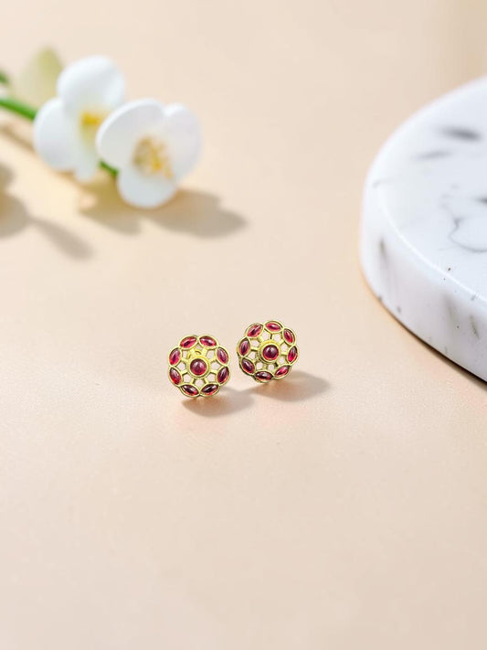 SHE BEAUTY COLOUR STUDS featuring gold-toned floral filigree design with deep red stone accents for ethnic wear