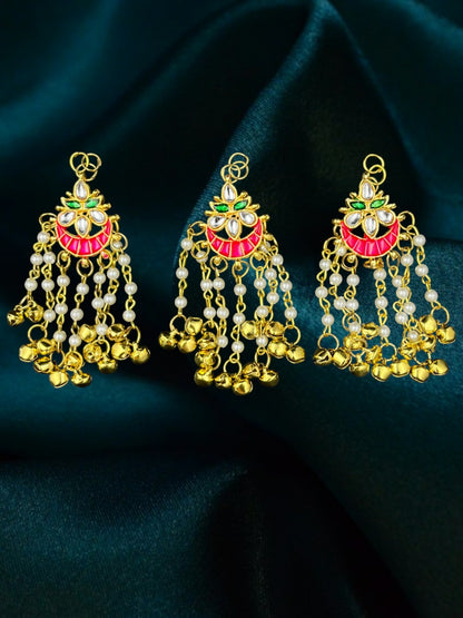 SHE BEAUTY crescent moon kundan meenakari hair accessories with pearl beads and gold ghungroo dangles on green fabric