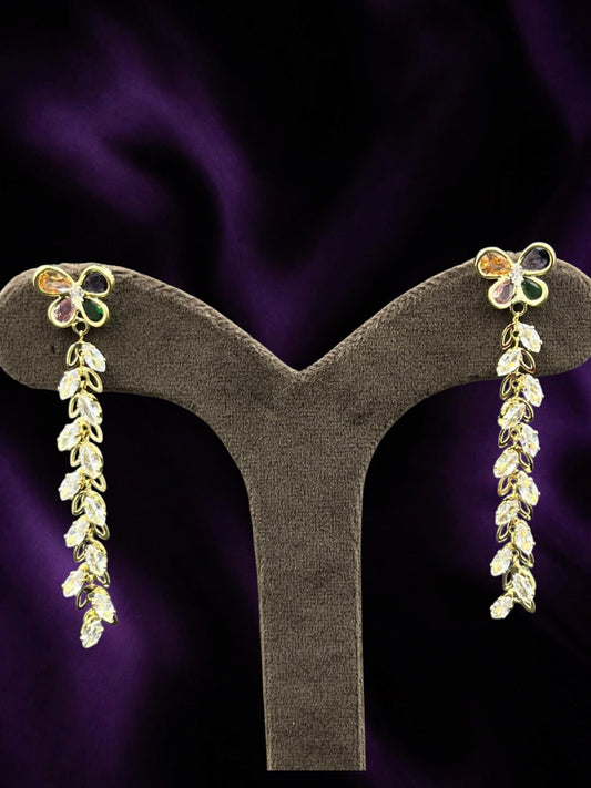SHE BEAUTY Crystal Trails earrings featuring gold-tone butterfly studs with multi-colored gems and dangling crystals.