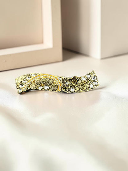 SHE BEAUTY curved vintage metallic barrette with intricate floral engravings and white stone accents for festive wear