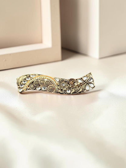 SHE BEAUTY curved vintage metallic barrette with intricate floral engravings and white stone accents for festive wear