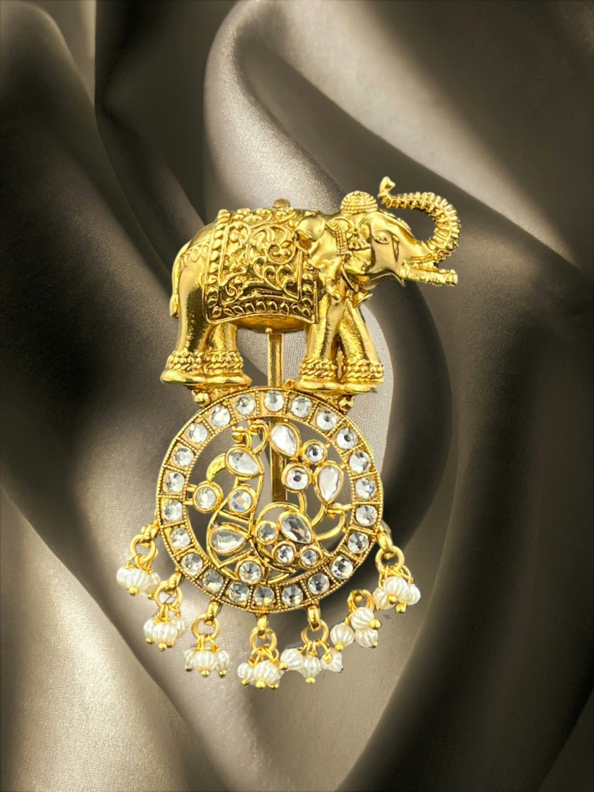 SHE BEAUTY gold-toned elephant juda hair brooch with ruby stones, intricate filigree, and dangling pearl accents.