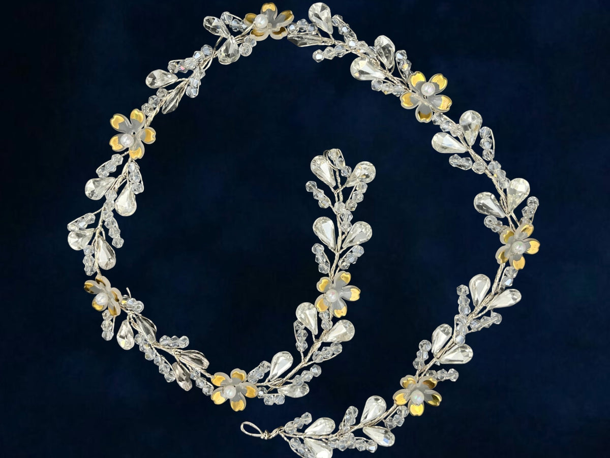 SHE BEAUTY floral hair vine featuring clear crystals, gold-tone flower accents, and pearls on a flexible wire frame.