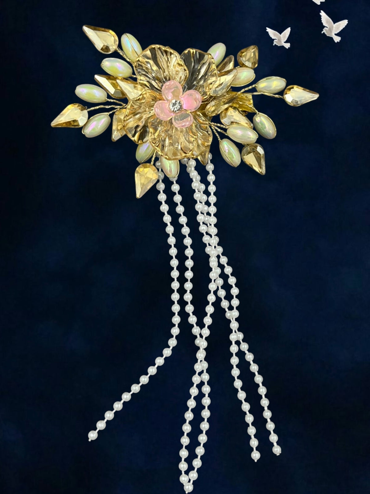 SHE BEAUTY floral hair pin with gold petals, pink center stone, and cascading white pearl beaded tassels