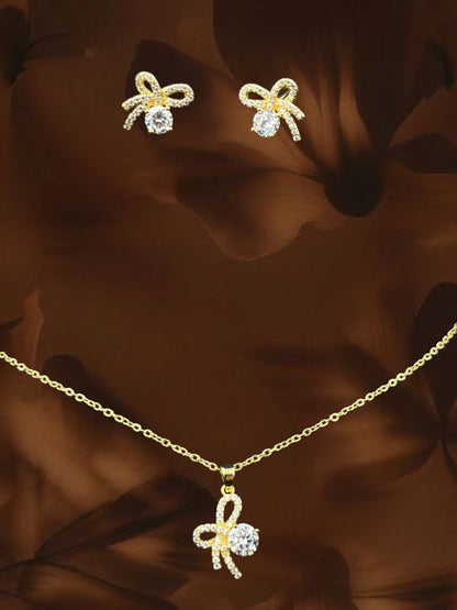 SHE BEAUTY flower knot pendant and earring set in gold tone with sparkling clear cubic zirconia stones