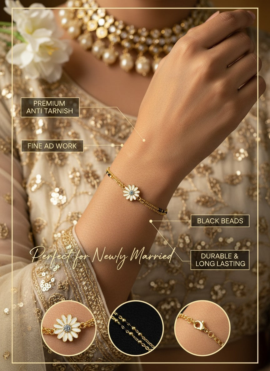 SHE BEAUTY anti-tarnish mangalsutra bracelet with a white flower charm, black beads, and gold-tone chain on a wrist.