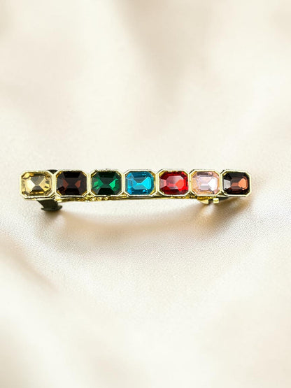 SHE BEAUTY barrette featuring seven rectangular multi-colored gemstones in a gold-tone setting for festive hair styling