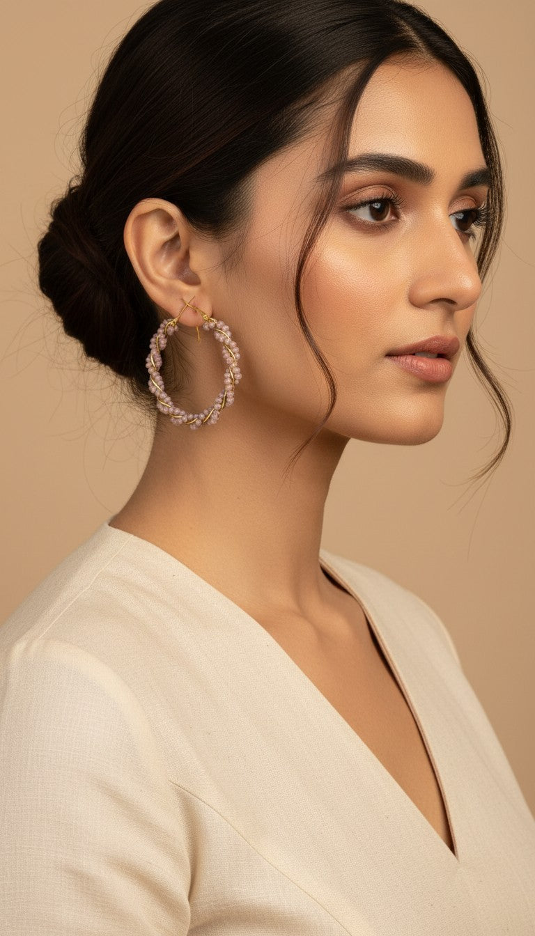 SHE BEAUTY GIRLISH CRYSTAL BALI hoop earrings featuring delicate light purple beads wrapped in gold wire on a model