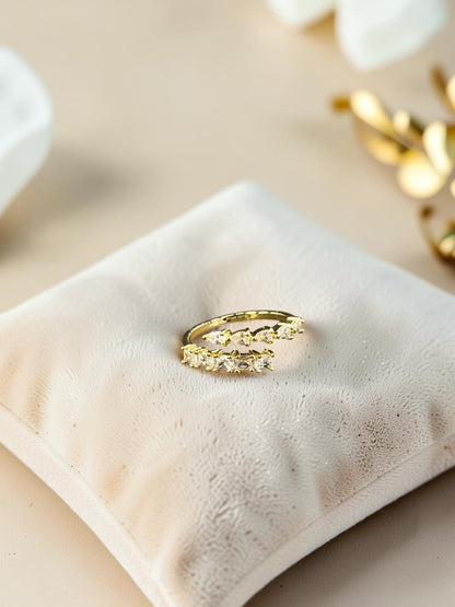 SHE BEAUTY gold-toned anti-tarnish ring featuring sparkling AD stones on a soft velvet display cushion